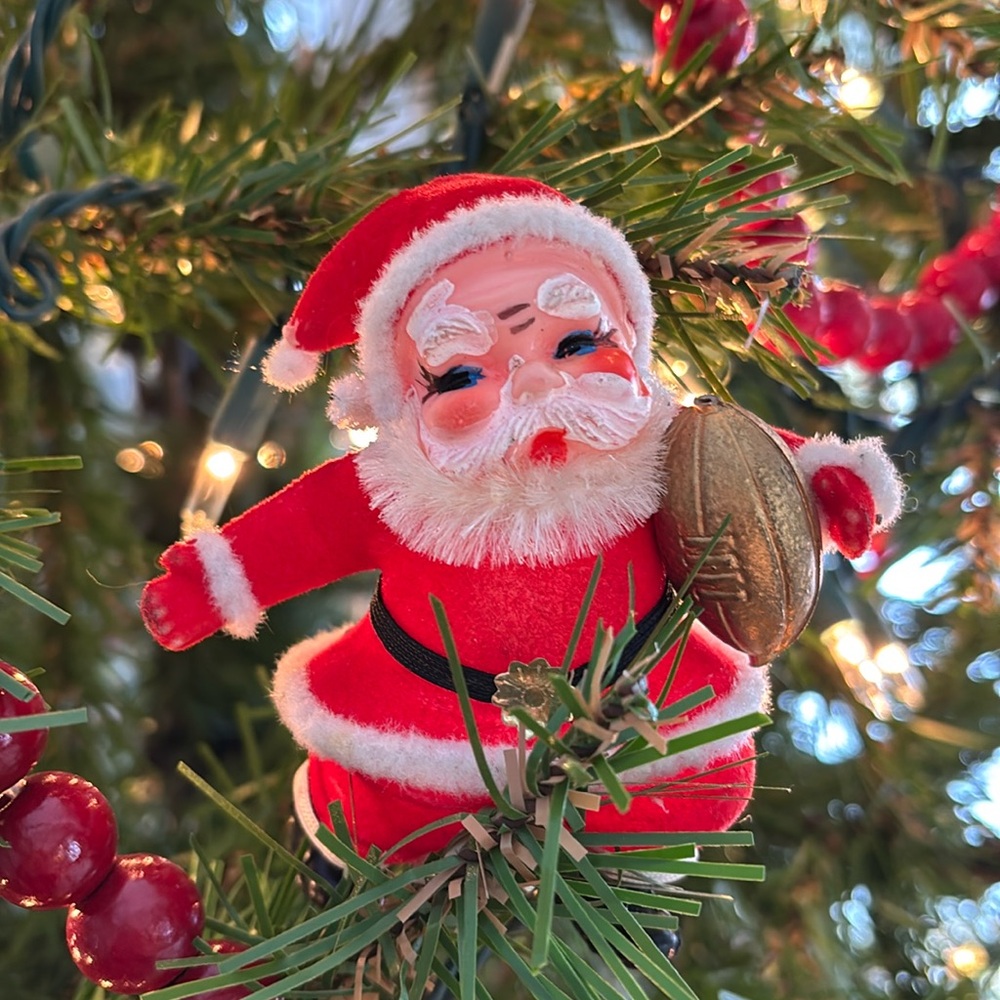 Vintage flocked Santa with football ornament